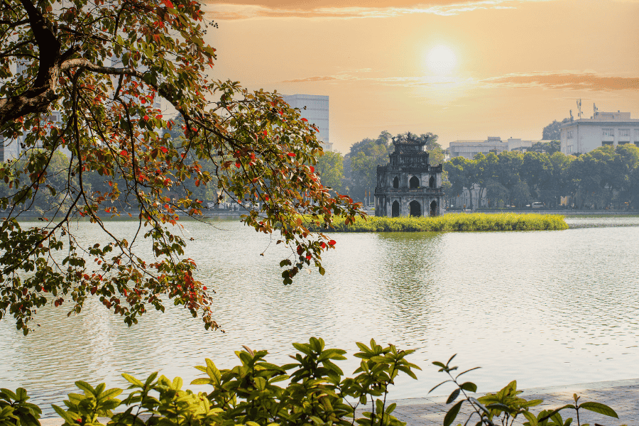 Sunset view of the historic Turtle Tower on Hoan Kiem Lake in Hanoi.