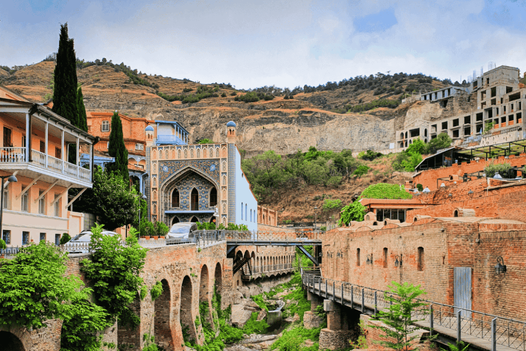 Historic district of Abanotubani in Tbilisi, showing traditional Georgian architecture and the famous mosaic-covered sulfur baths.