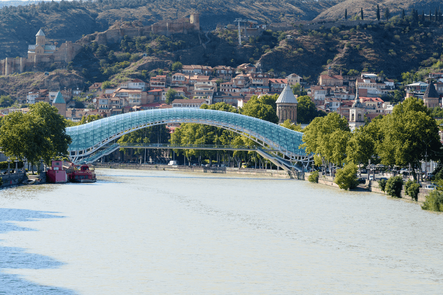 Scenic view of the Bridge of Peace and Old Tbilisi hillside.