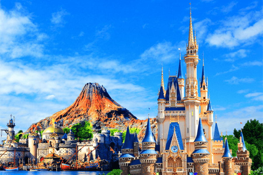 Tokyo Disney Resort featuring Cinderella Castle with blue spires and Mount Prometheus from DisneySea