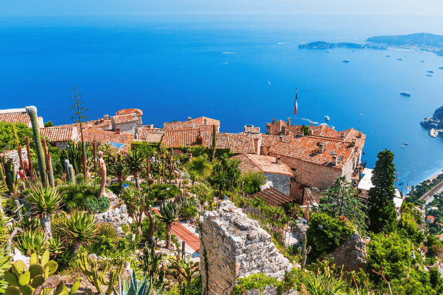 View from the Le Jardin Exotique in the hilltop village of Èze, France, overlooking the vibrant blue Mediterranean Sea.