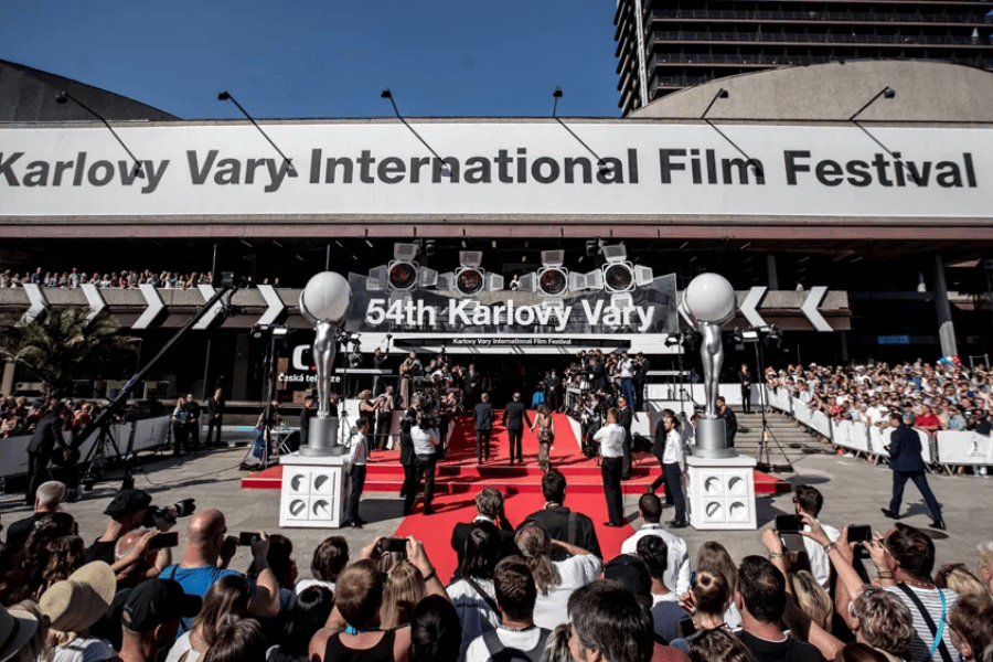 A wide shot of the red carpet entrance at the 54th Karlovy Vary International Film Festival in the Czech Republic.